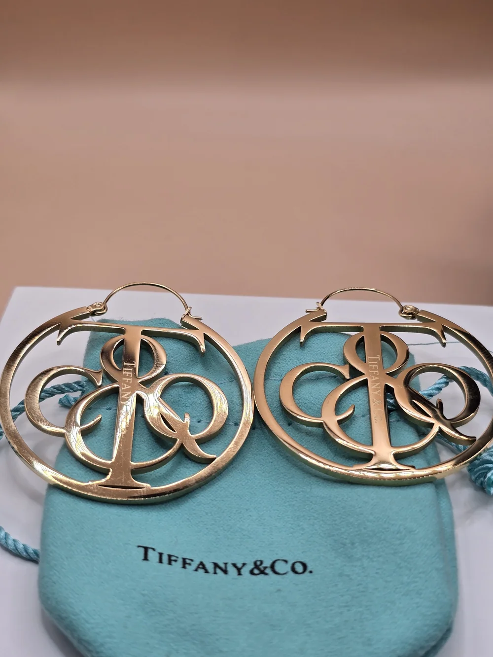 Tiffany & Co. Gold-Tone Monogram Pendant Necklace & Hoop Earrings Jewelry Set.